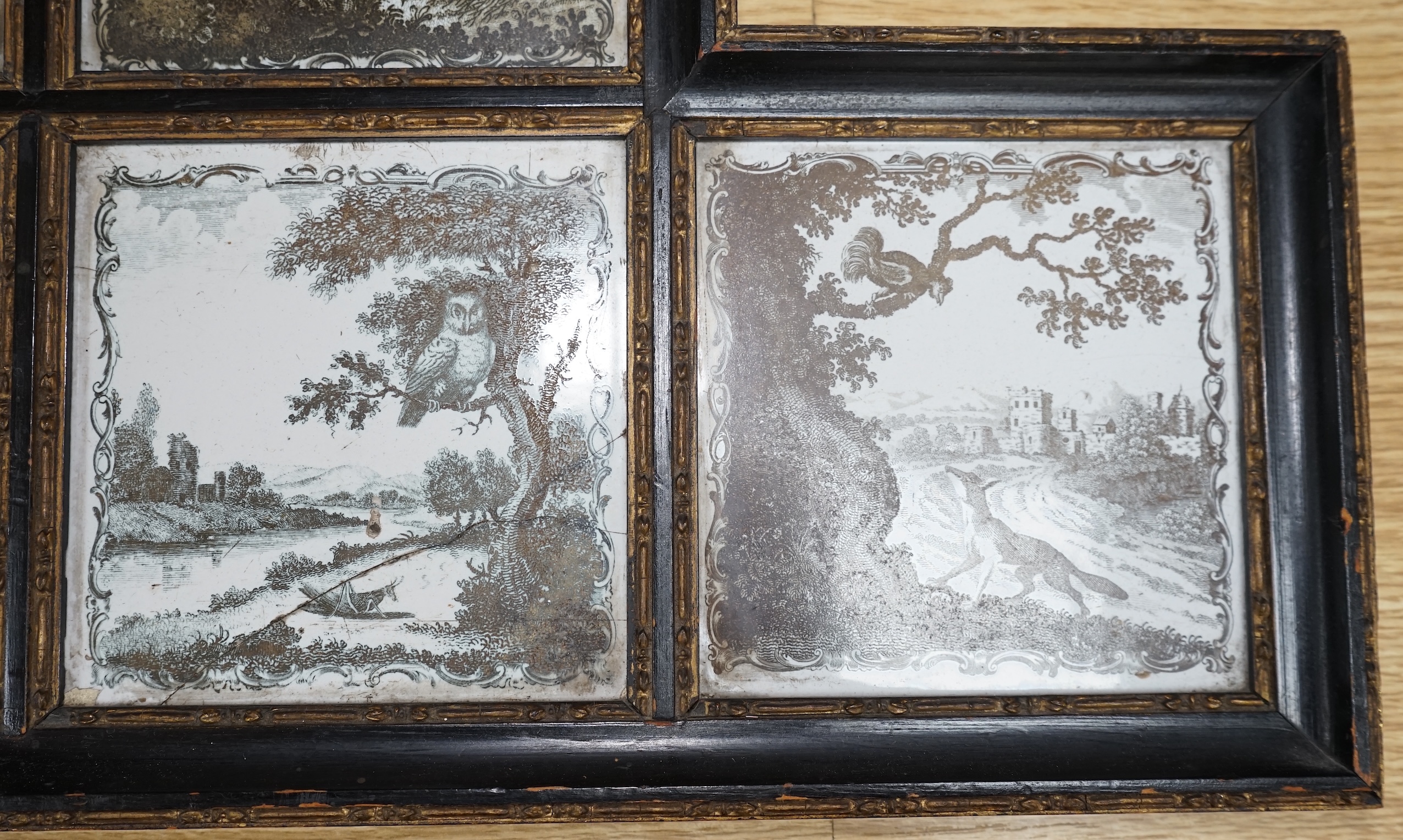 A framed set of six 18th century Liverpool delftware black and white printed tiles, Aesop’s Fables by Sadler, 57cm wide. Condition - fair